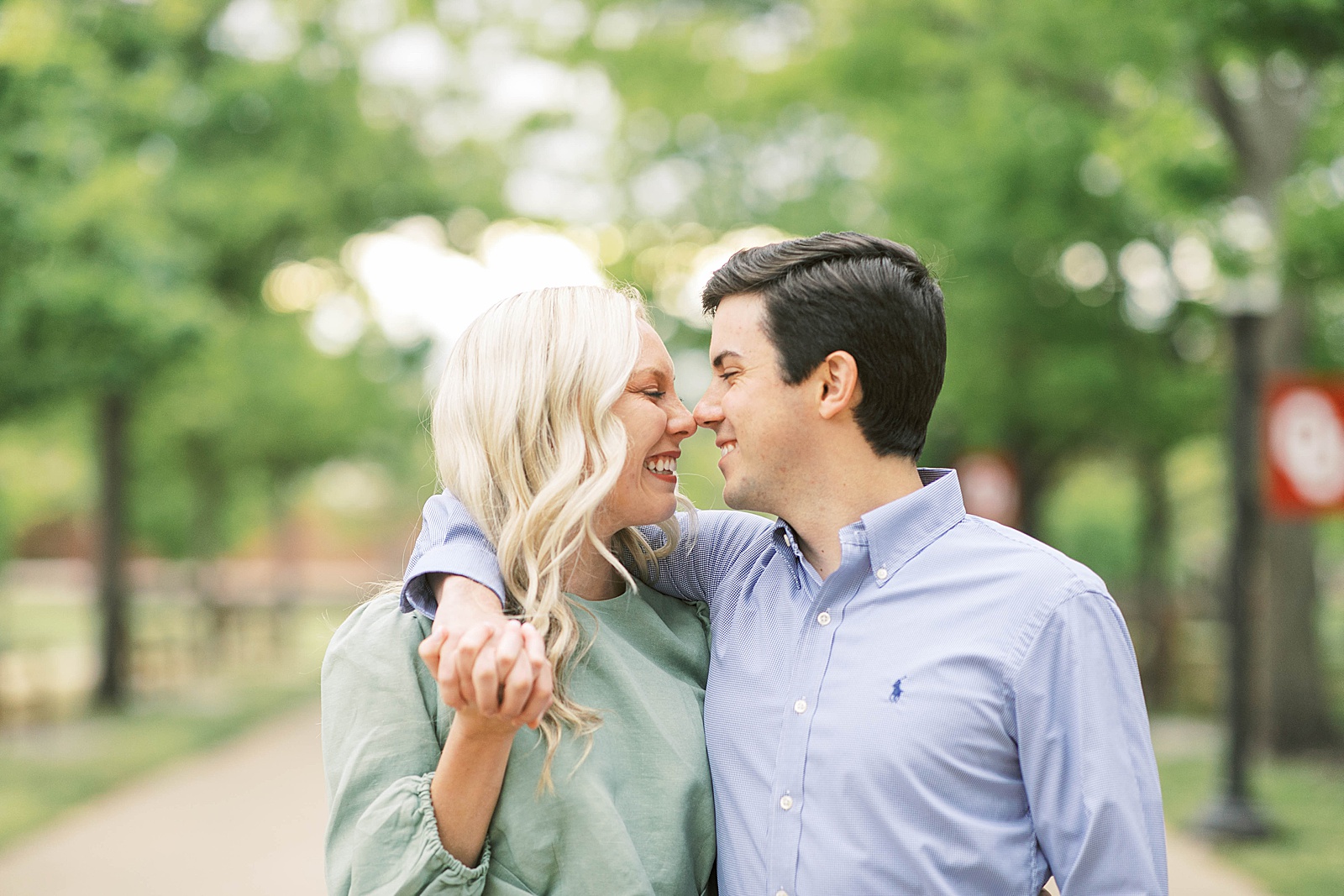 couple embraces celebrating spring proposal at ou